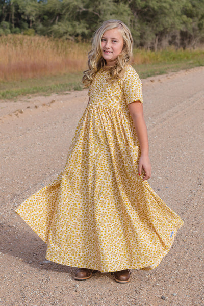 Cream, Mustard and Ginger hued ditsy floral fabric  Floor Length knit Maxi dress with oversized pockets, short sleeves and empire waist